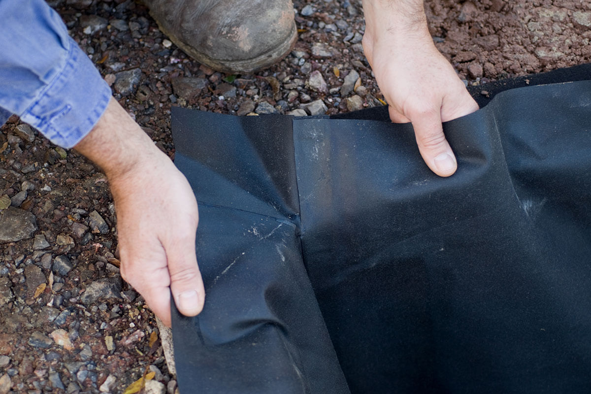 A flexible liner being pulled into place