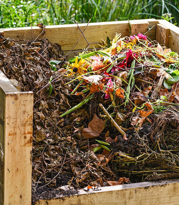 A full wooden compost bin
