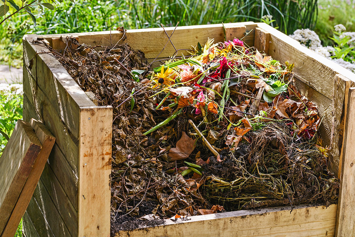 A full wooden compost bin